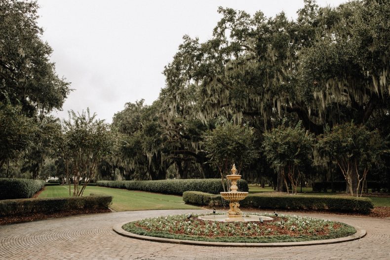 ornate gold fountain in roundabout of ford plantation