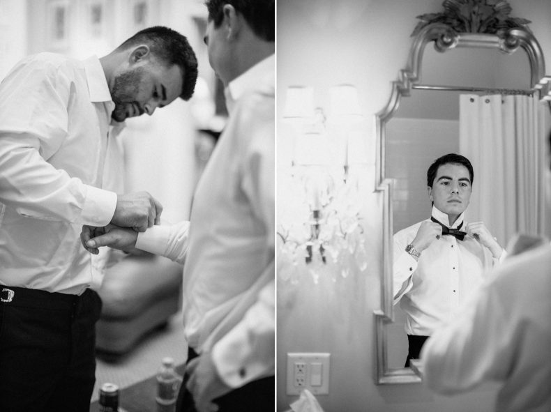 groom tying bowtie in bathroom mirror on right and groomsmen fastening cufflinks on grooms shirt