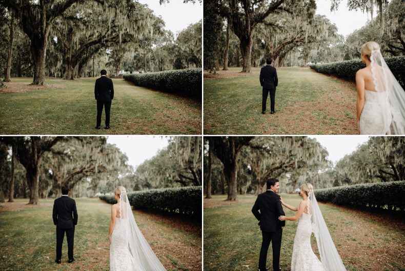 bride walking up behind groom for first look among mossy oak trees in savannah